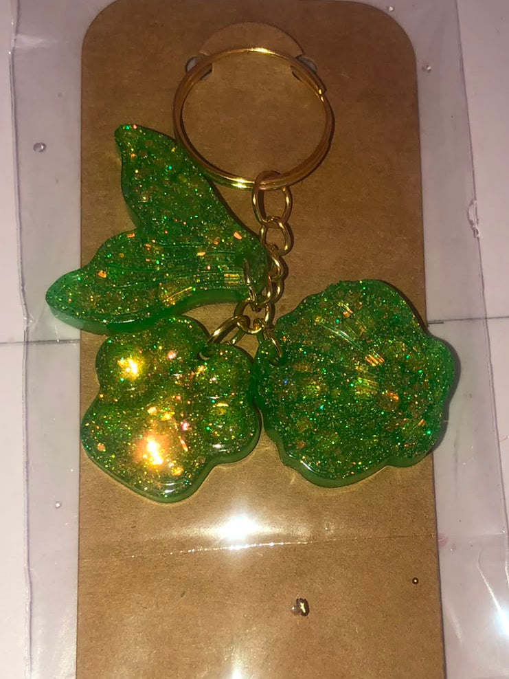 Green glitter resin cherry keychain on kraft card
